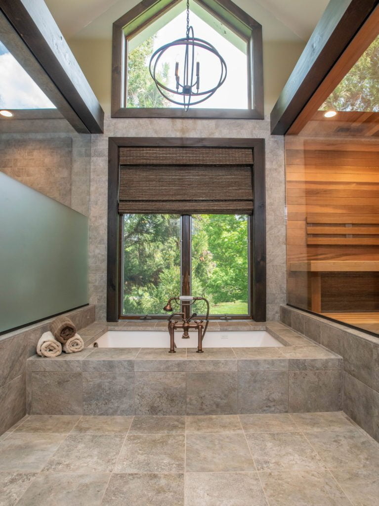 Contemporary bathtub lined with granite tile