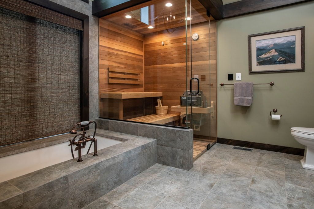 Walk in shower/sauna with wood detailing within rustic/contemporary bathroom