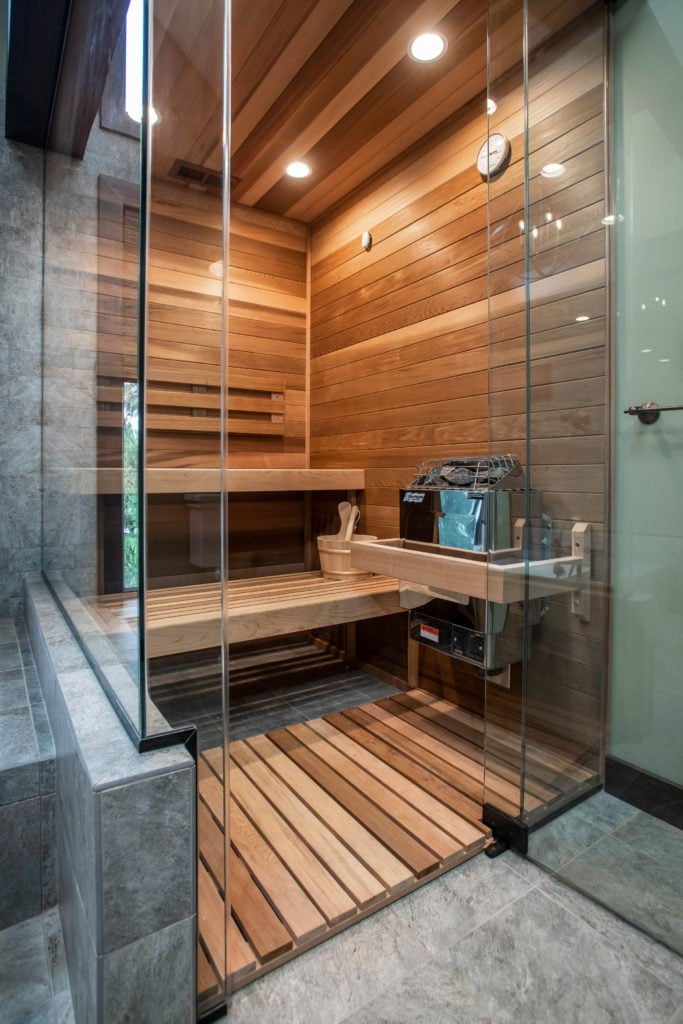 Walk in shower/sauna with wood detailing completed as a renovation by Sunnyfields Cabinetry in Baltimore.