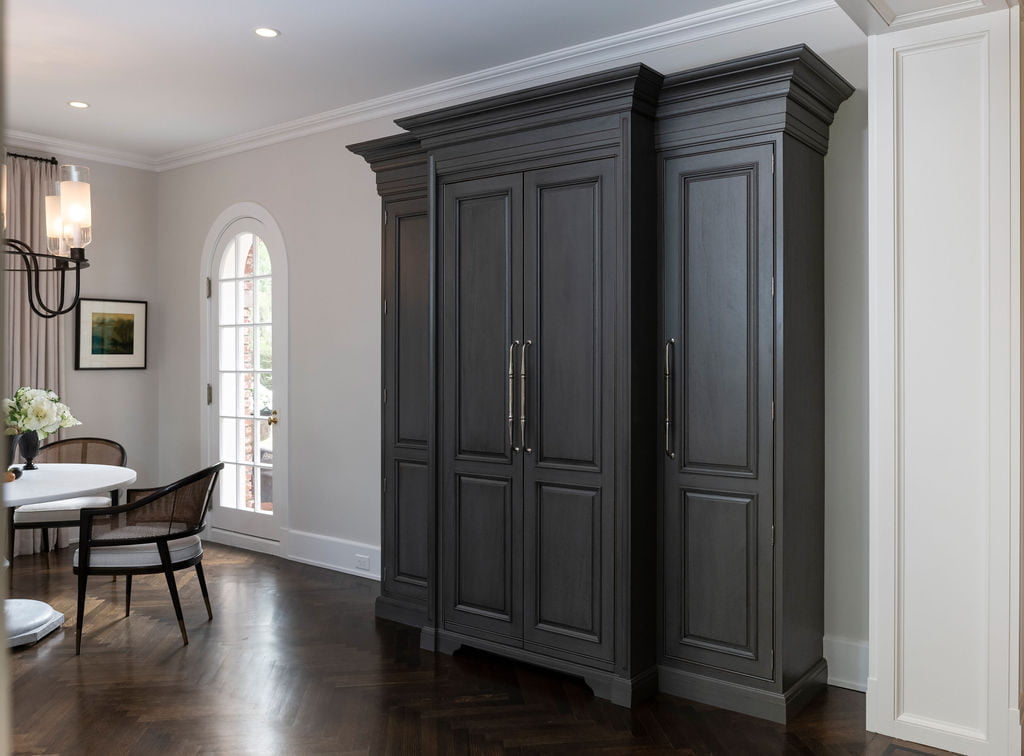 Grey wood transitional armoire on dark chevron hardwood flooring (Closed) (Side)