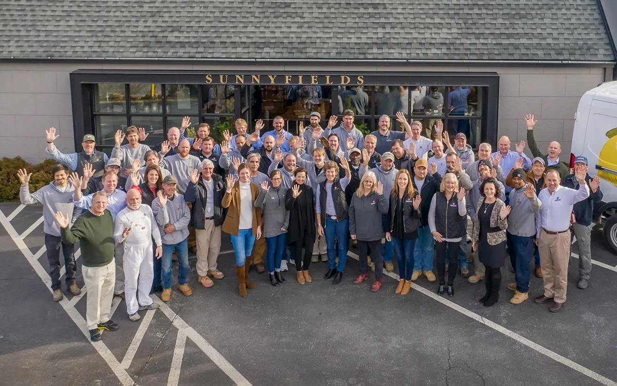 DACG-Team-Drone-Still Team photo of employees at Sunnyfields Cabinetry and DACG in Baltimore, Maryland.