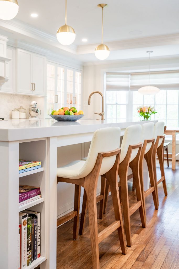 Transitional kitchen island with wooden hi-top chairs and white leather seats